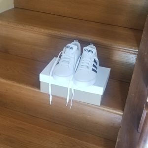 A pair of  Adidas sneakers